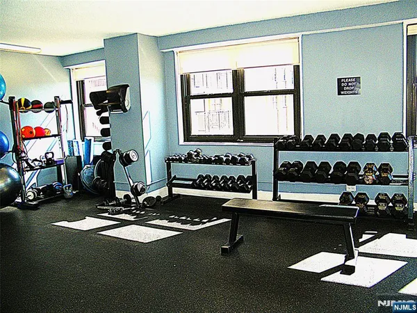 a room with gym equipment and window