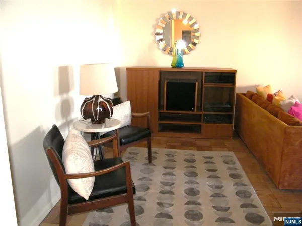 a living room with a sink and furniture