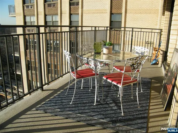 a view of a balcony with a potted plant