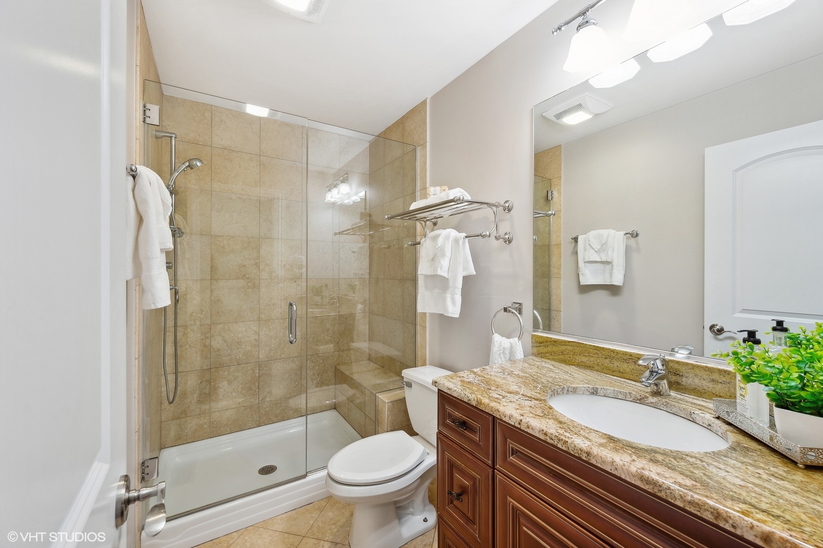 2736 Glenview Road Glenview, IL 60025 - Photo 15 of 31 a bathroom with a granite countertop sink toilet and shower