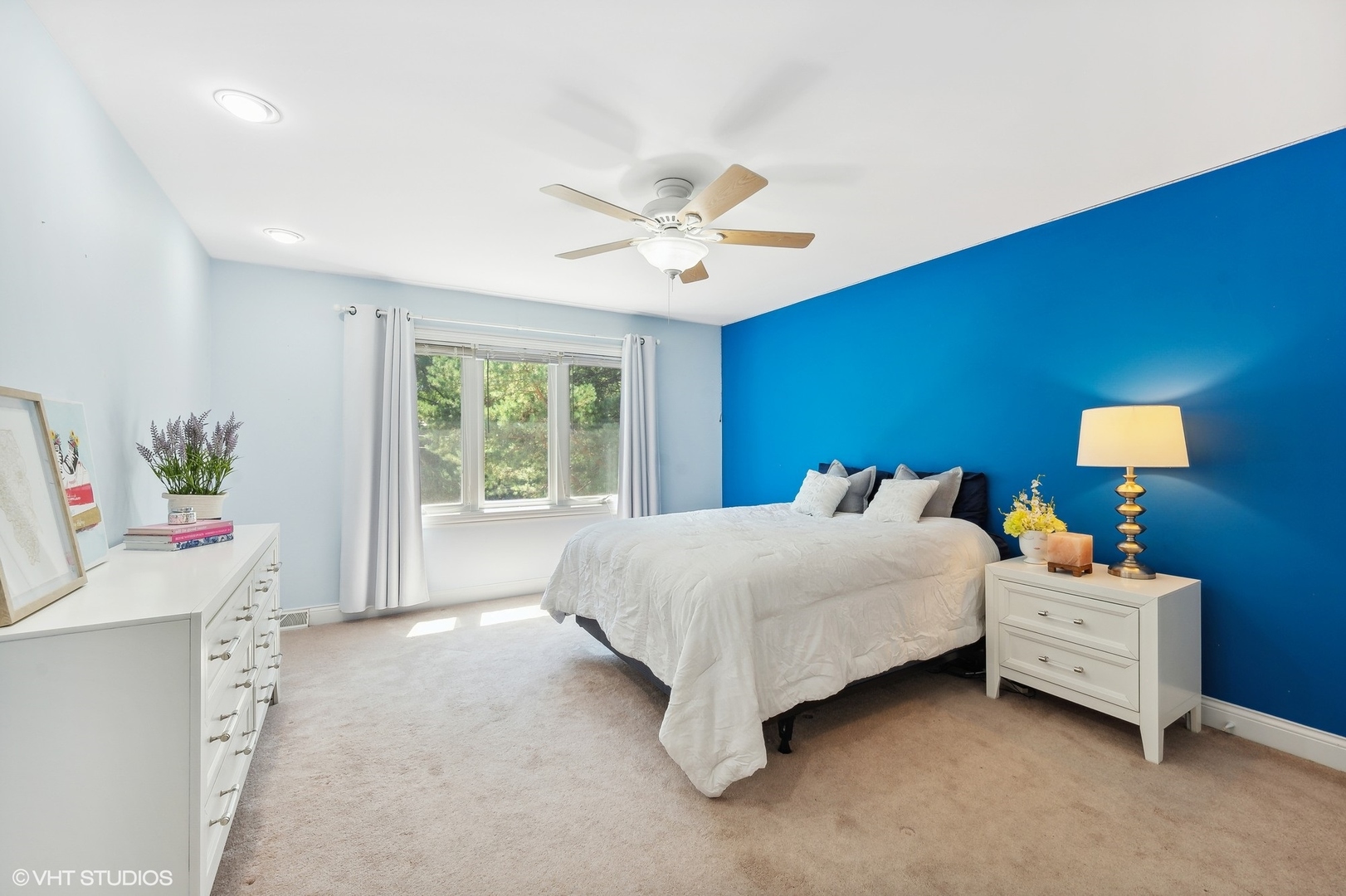 2736 Glenview Road Glenview, IL 60025 - Photo 18 of 31 a bed room with a bed and a chandelier