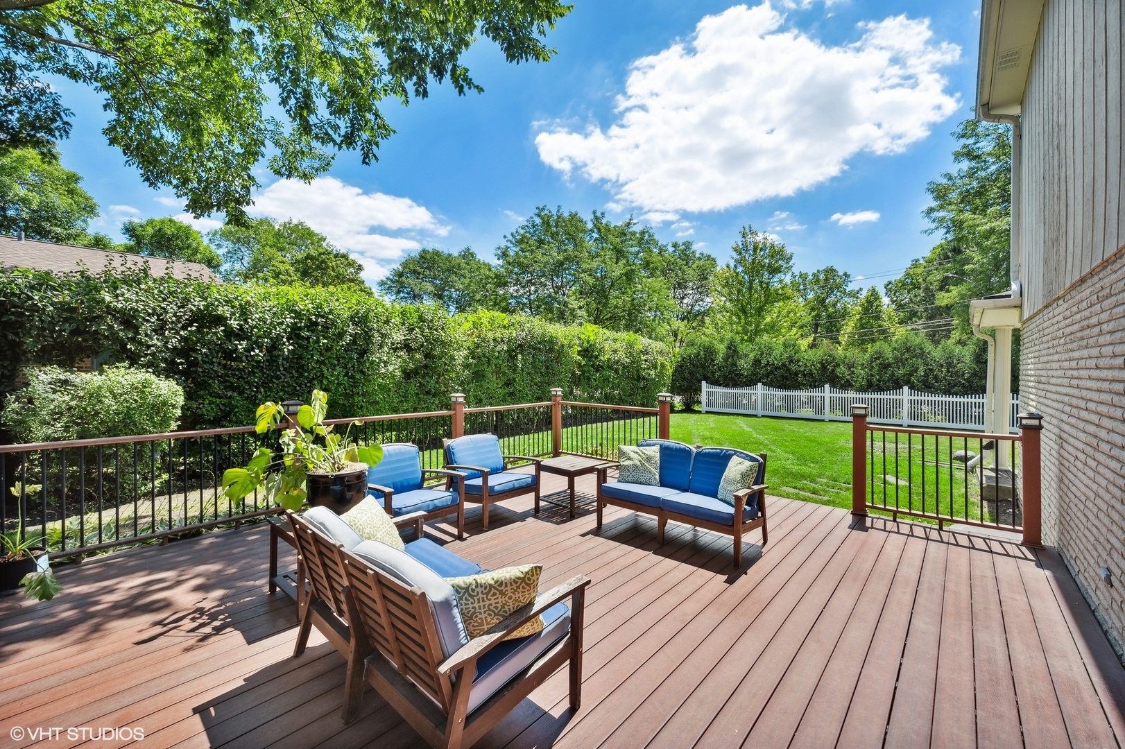 2736 Glenview Road Glenview, IL 60025 - Photo 27 of 31 a view of a deck with couches table and chairs with wooden floor and fence