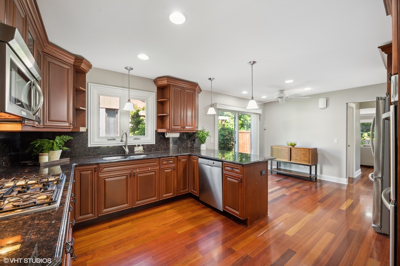 2736 Glenview Road Glenview, IL 60025 - Photo 7 of 31 a large kitchen with stainless steel appliances granite countertop a lot of cabinets and wooden floor