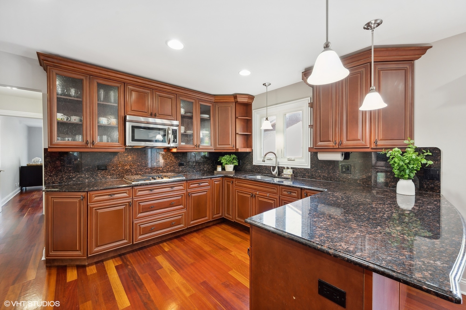 2736 Glenview Road Glenview, IL 60025 - Photo 8 of 31 a kitchen with stainless steel appliances granite countertop a sink a stove and a wooden floors