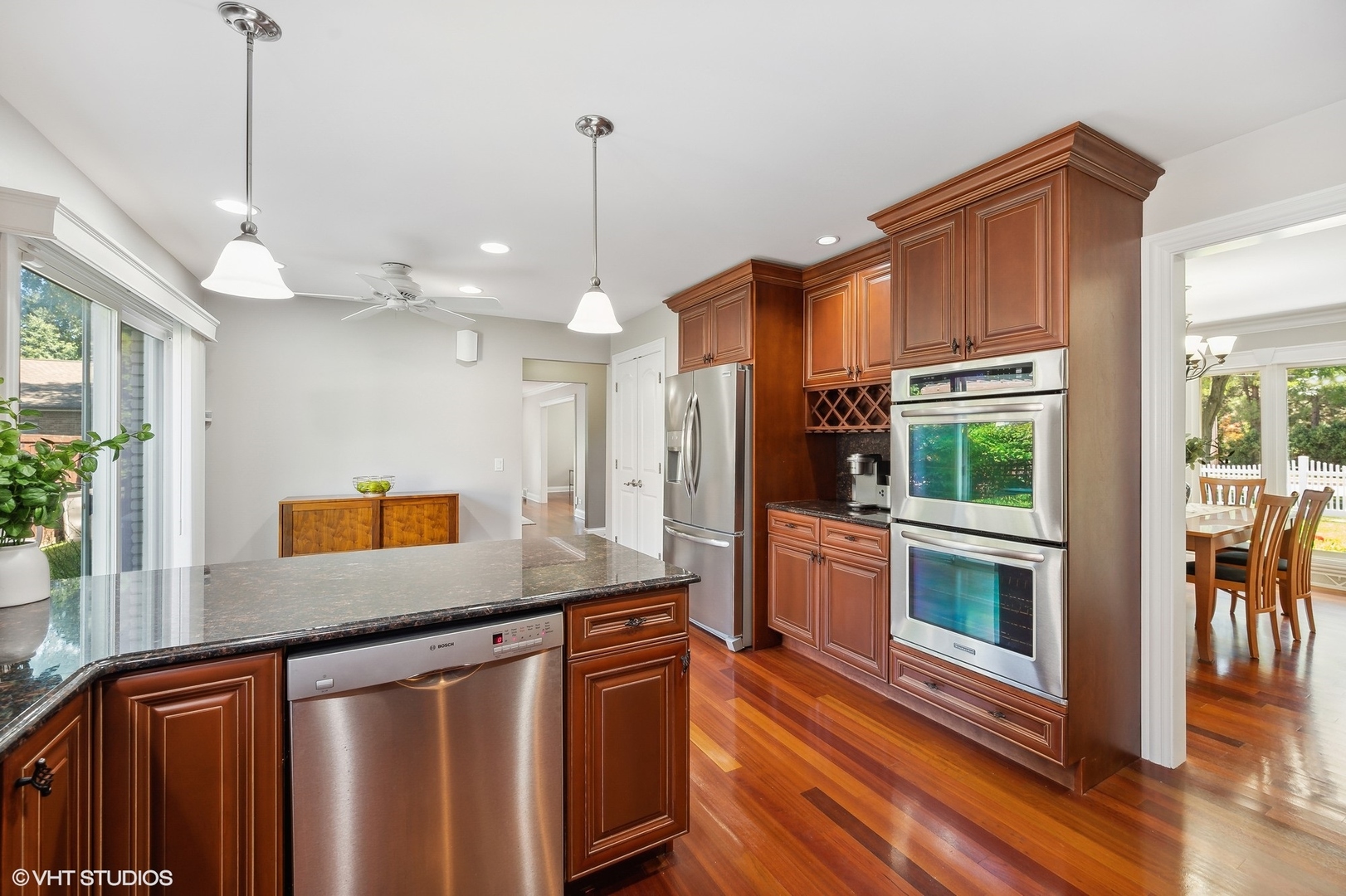 2736 Glenview Road Glenview, IL 60025 - Photo 9 of 31 a kitchen with stainless steel appliances granite countertop a stove a sink and a refrigerator with wooden floor