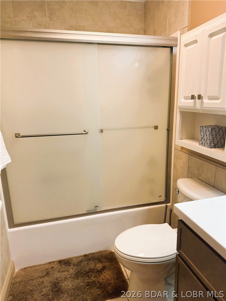 1442 Nichols Road, Unit D301 Osage Beach, MO 65065 - Photo 11 of 42 NEW Shower Door, Vanity & Lighting
