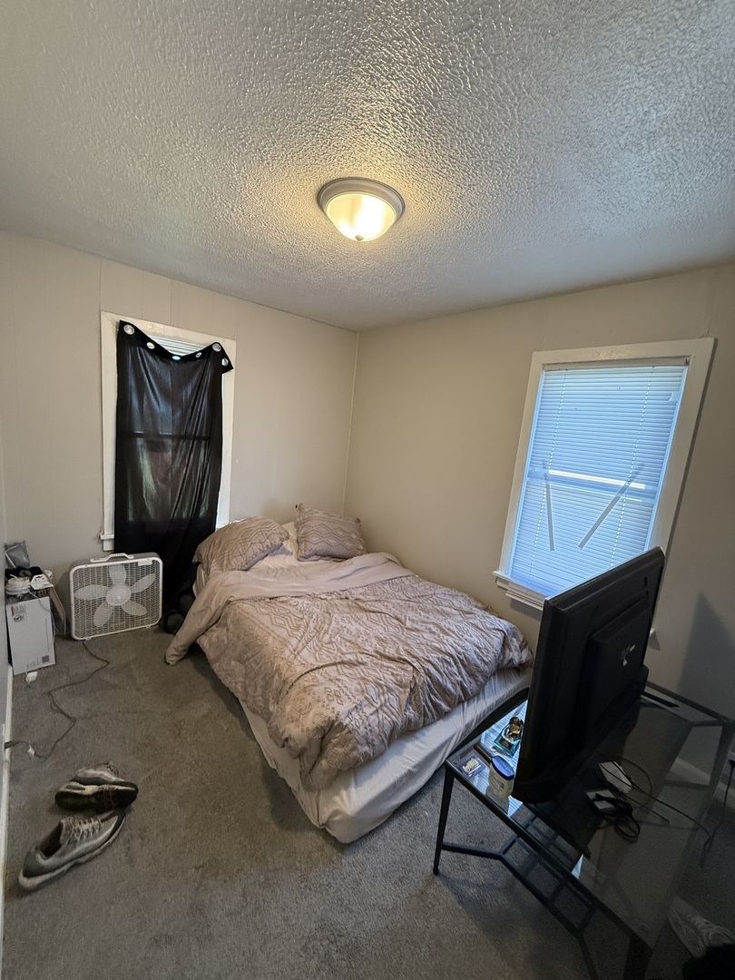 625 South Gordon Avenue Kankakee, IL 60901 - Photo 8 of 15 a bedroom with a bed and dresser