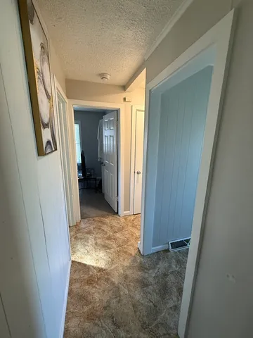 a view of entryway with bathroom