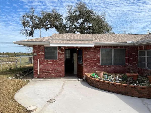 front view of a house with a garden