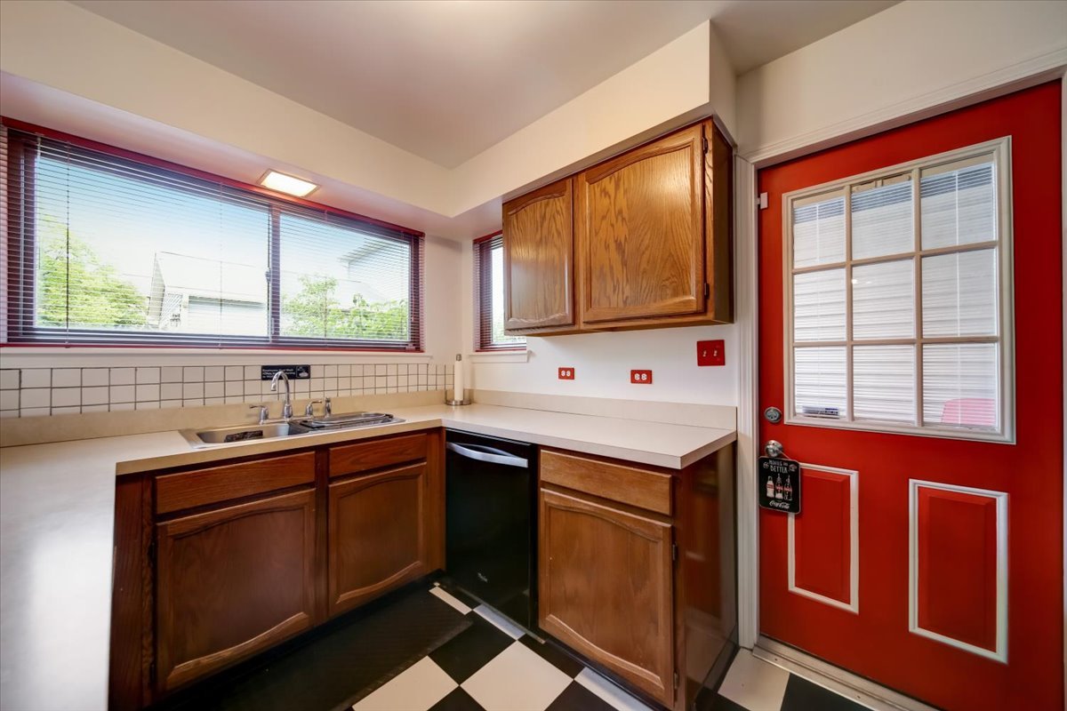 8325 High Point Circle, Unit A Darien, IL 60561 - Photo 13 of 42 a kitchen with a sink stove and cabinets