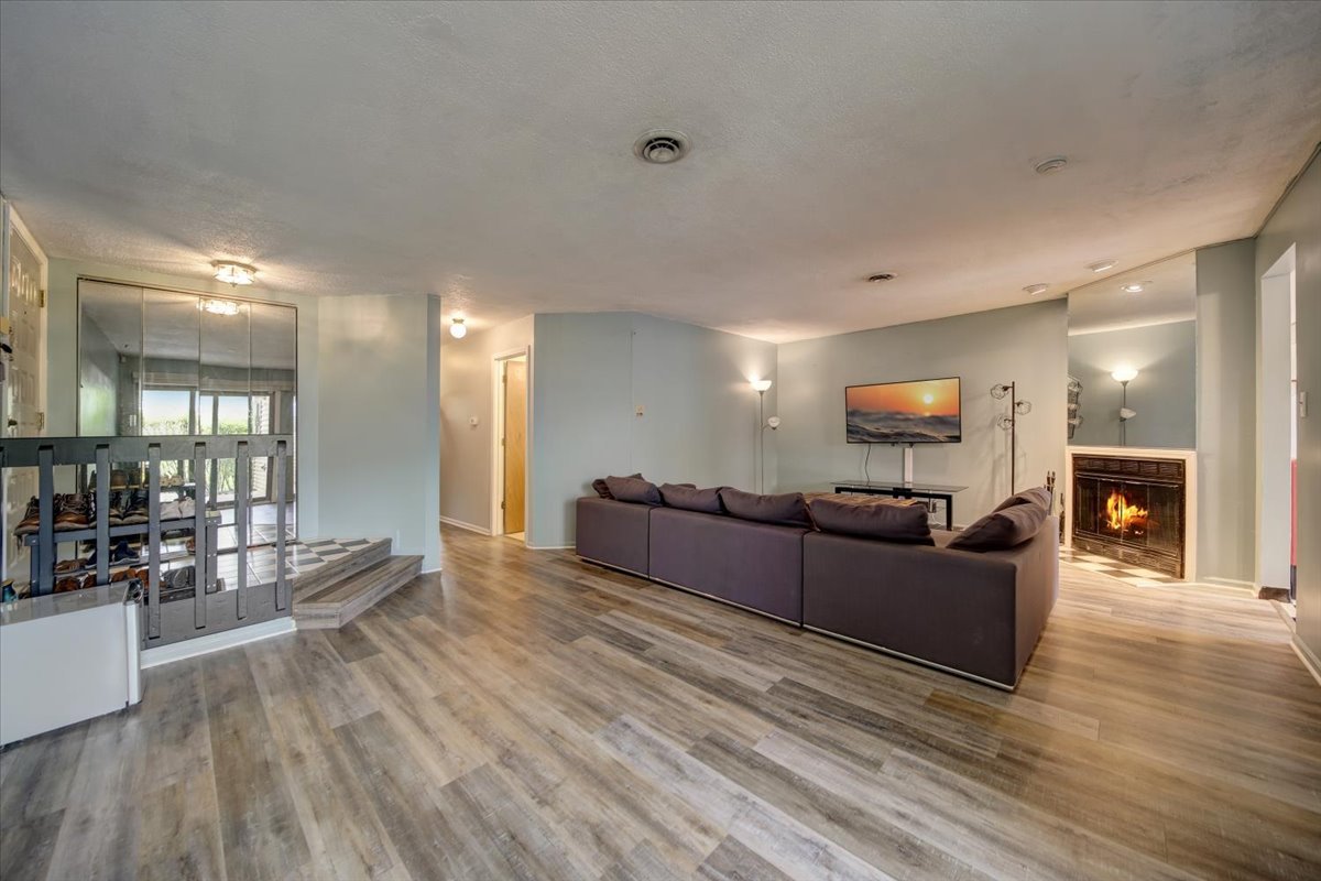 8325 High Point Circle, Unit A Darien, IL 60561 - Photo 2 of 42 a living room with furniture and a fireplace