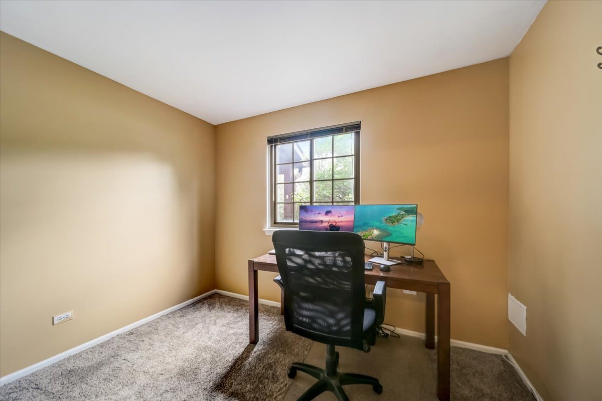 8325 High Point Circle, Unit A Darien, IL 60561 - Photo 23 of 42 a workspace with furniture and window