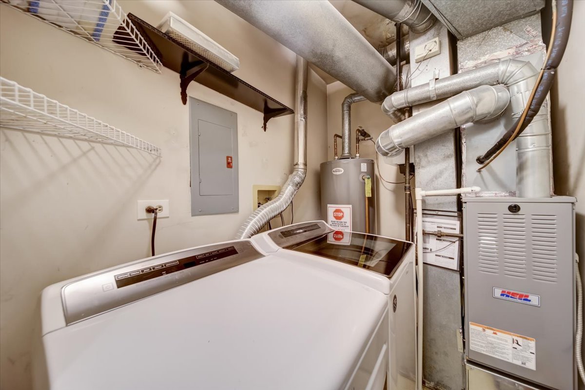 8325 High Point Circle, Unit A Darien, IL 60561 - Photo 26 of 42 a bathroom with a sink and a mirror