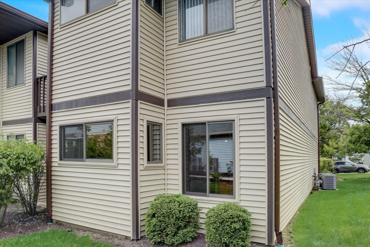 8325 High Point Circle, Unit A Darien, IL 60561 - Photo 31 of 42 a view of a house with a yard