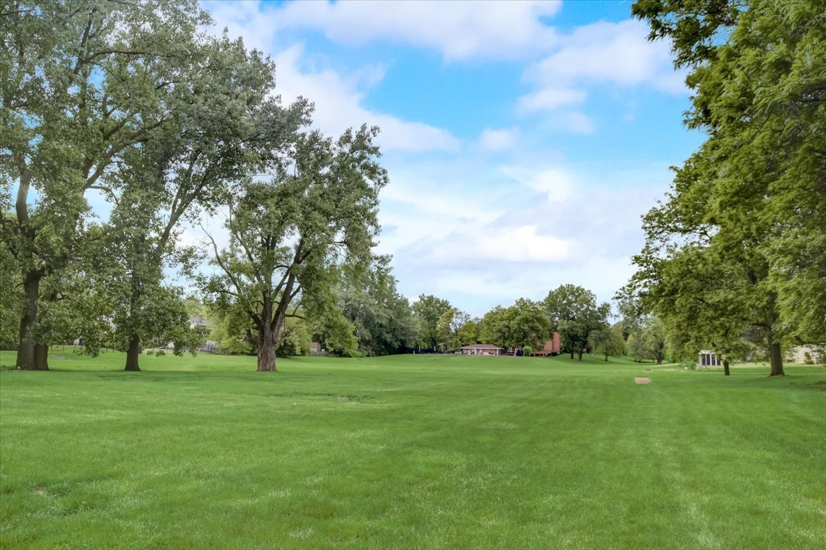 8325 High Point Circle, Unit A Darien, IL 60561 - Photo 39 of 42 a view of grassy field with benches
