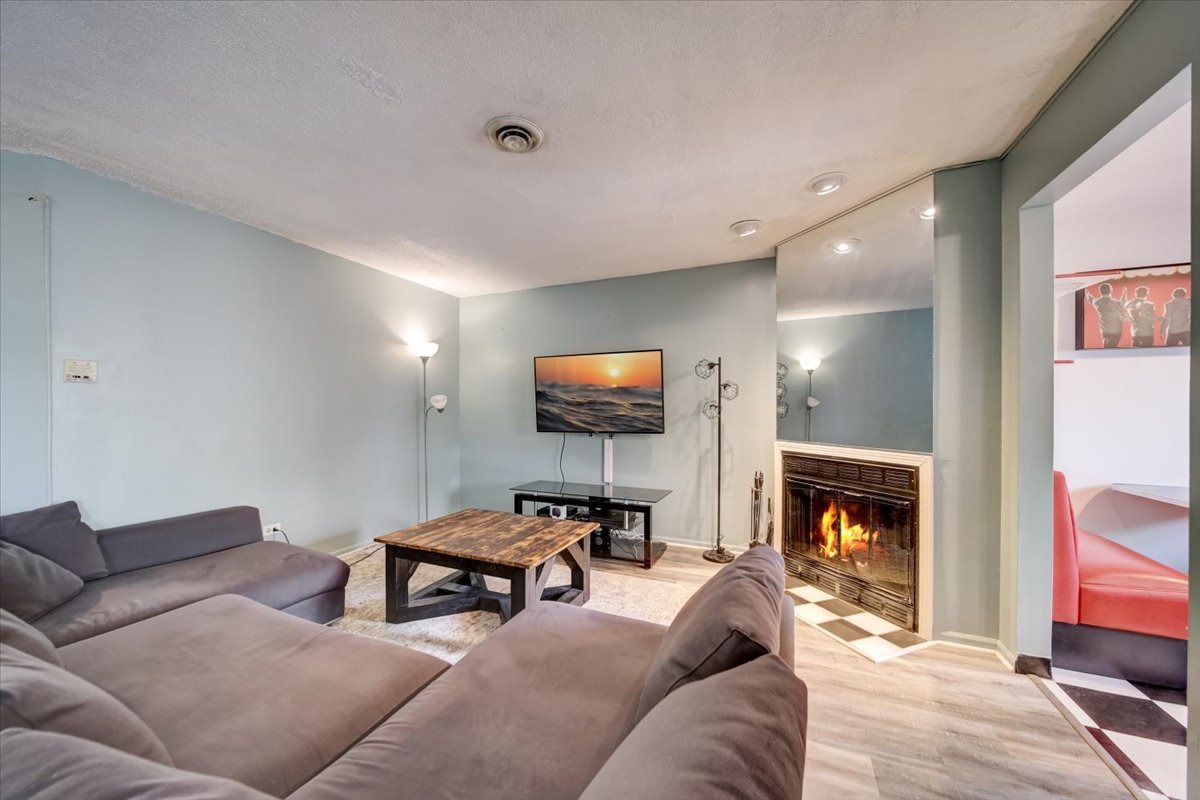 8325 High Point Circle, Unit A Darien, IL 60561 - Photo 5 of 42 a living room with furniture and a fireplace