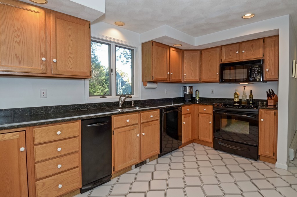 2 Marions Way Georgetown, MA 01833 - Photo 11 of 29 a kitchen with stainless steel appliances granite countertop a sink stove top oven and microwave