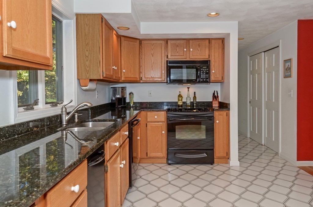 2 Marions Way Georgetown, MA 01833 - Photo 8 of 29 a kitchen with granite countertop a stove sink and cabinets