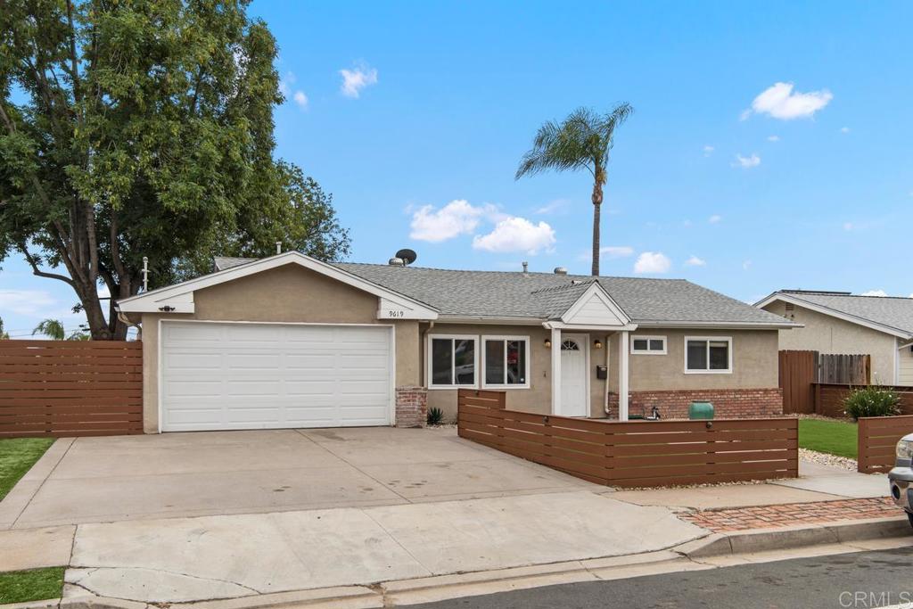 9619 Mast Boulevard Santee, CA 92071 - Photo 1 of 1 a front view of a house with a garden and yard
