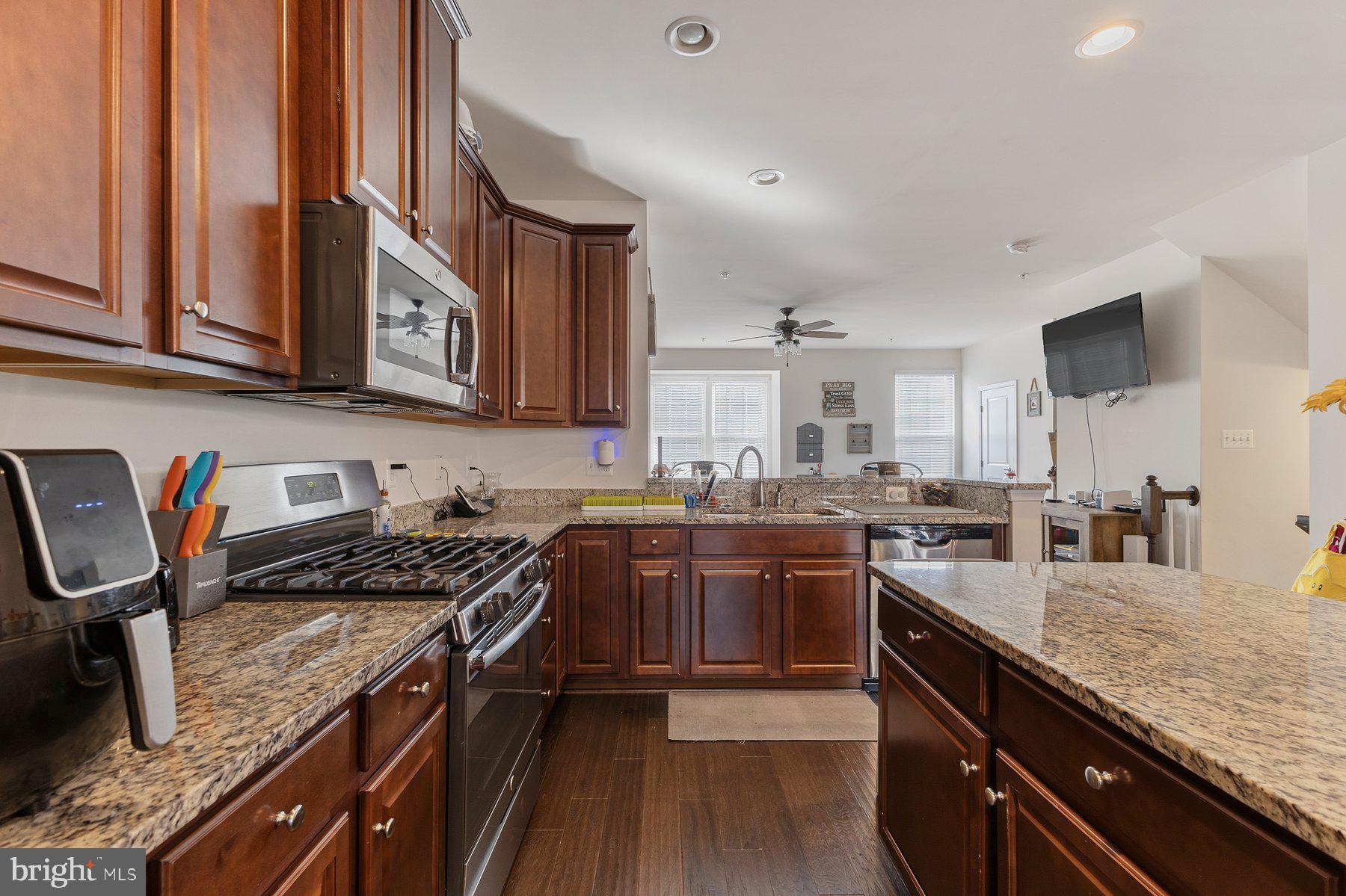 12217 Timberlake Place Waldorf, MD 20601 - Photo 4 of 34 Modern kitchen with rich wood accents.