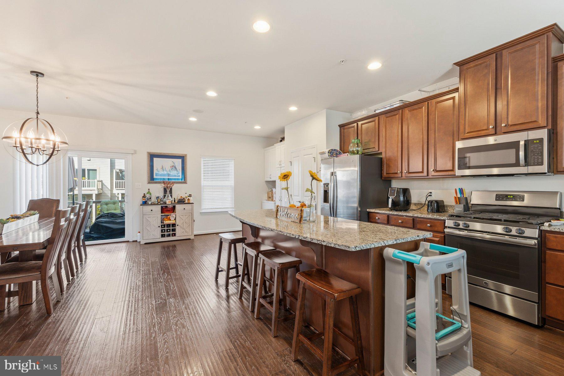12217 Timberlake Place Waldorf, MD 20601 - Photo 5 of 34 Modern kitchen with warm wood accents.