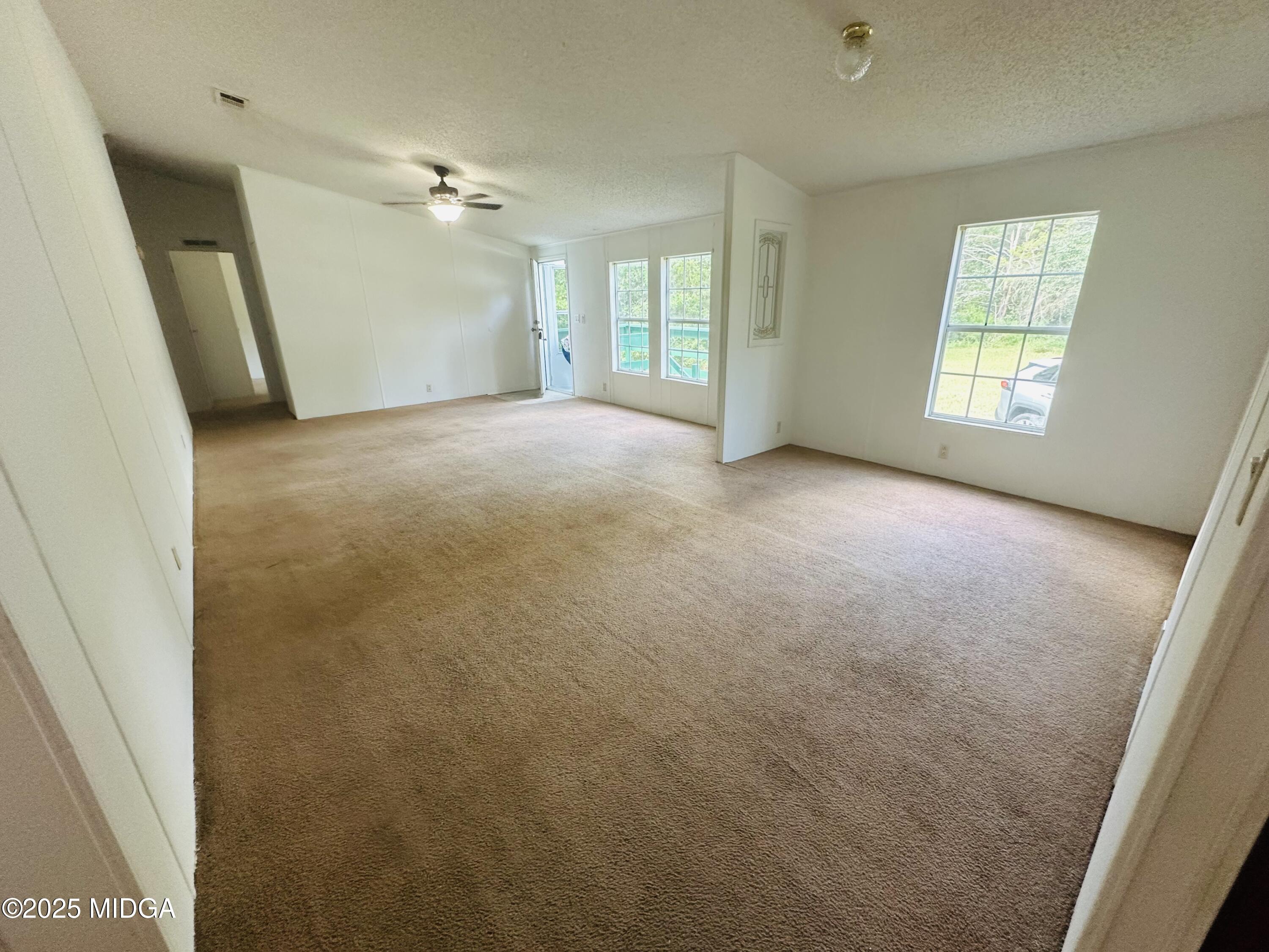 735 Pope Road Roberta, GA 31078 - Photo 11 of 36 an empty room with windows and closet
