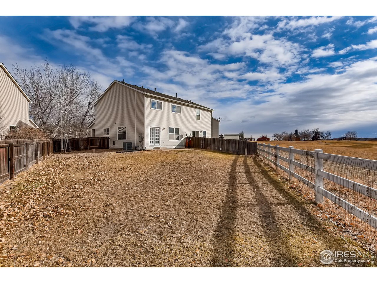 261 Ponderosa Place Fort Lupton, CO 80621 - Photo 13 of 15 a view of residential houses with outdoor space