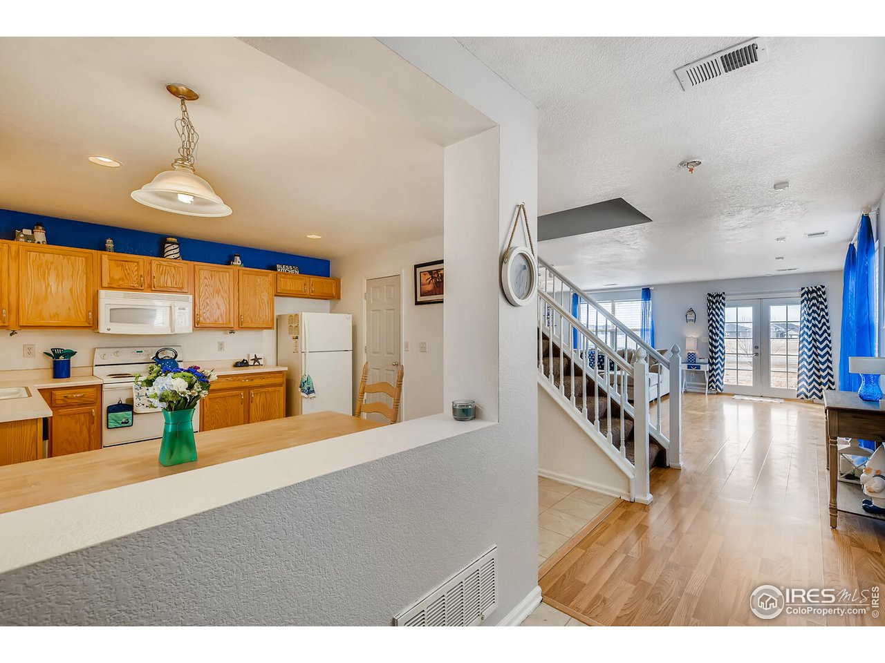 261 Ponderosa Place Fort Lupton, CO 80621 - Photo 3 of 15 a view of a livingroom with furniture and hardwood floor