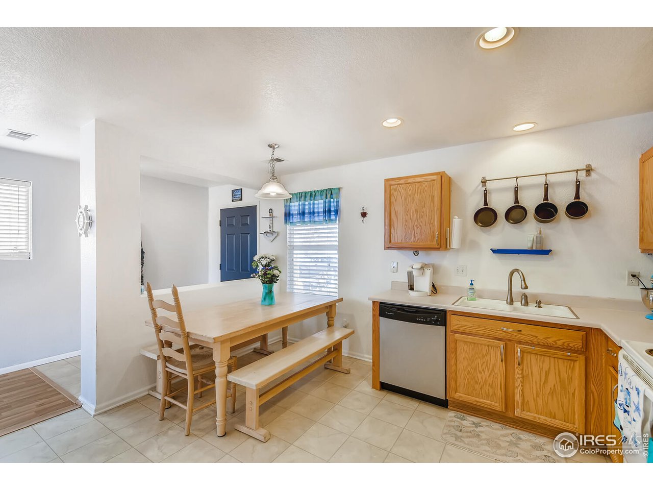 261 Ponderosa Place Fort Lupton, CO 80621 - Photo 5 of 15 a kitchen with a sink and cabinets