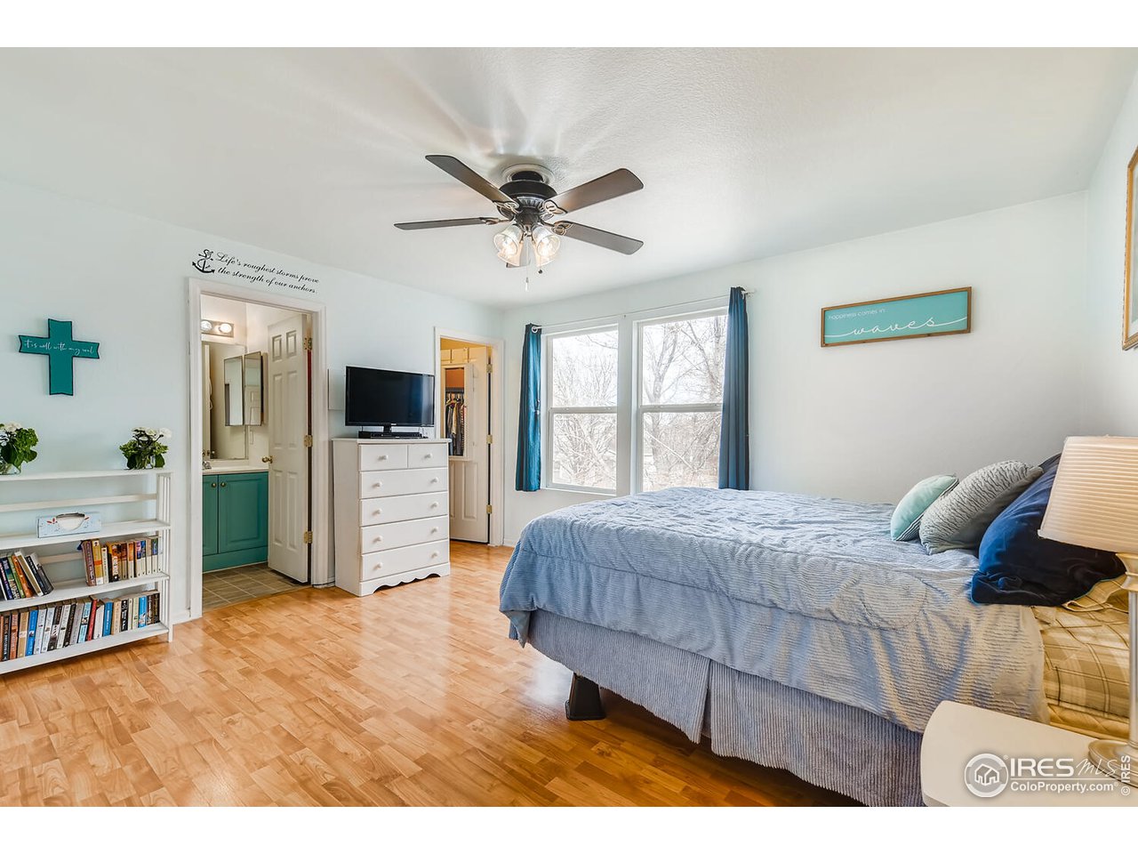 261 Ponderosa Place Fort Lupton, CO 80621 - Photo 7 of 15 a bedroom with furniture and a window