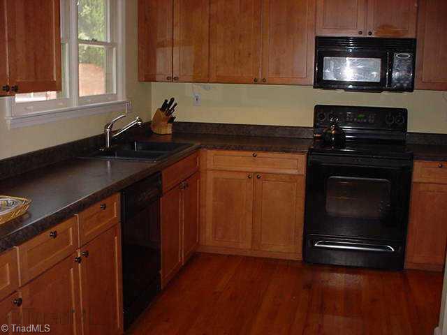 Other. Kitchen with HW floors. Appliances include microwave, smooth top stove, DW and Side by Side refrigerator