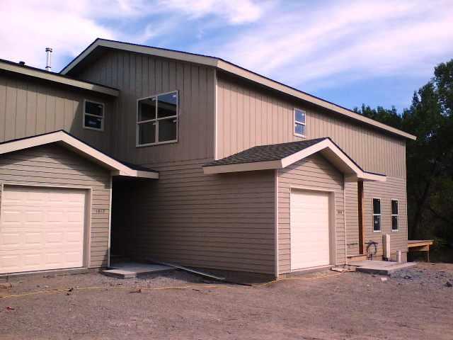 1012 East Avenue, Unit 2 Rifle, CO 81650 - Photo 2 of 2 a front view of a house with a garage