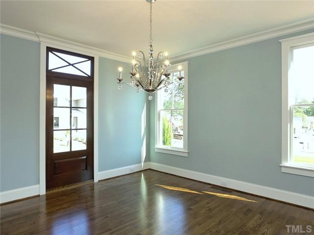 2004 Vinnings Place Raleigh, NC 27608 - Photo 3 of 22 a view of an empty room with wooden floor and a window