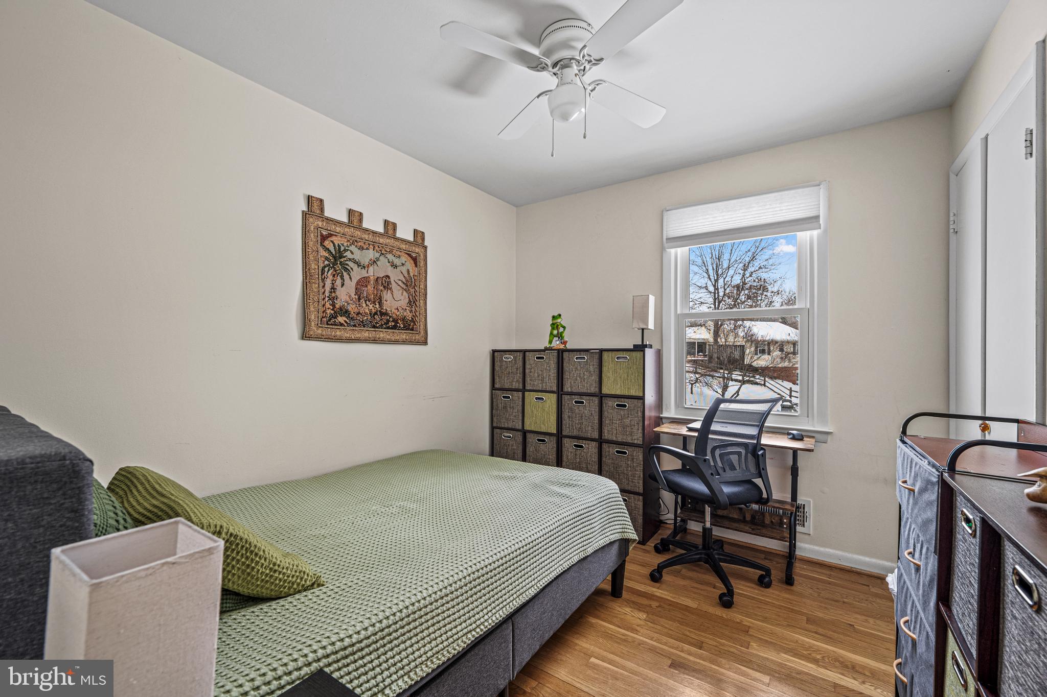 3205 Llewellyn Field Road Olney, MD 20832 - Photo 21 of 39 a bedroom with a bed and a chandelier
