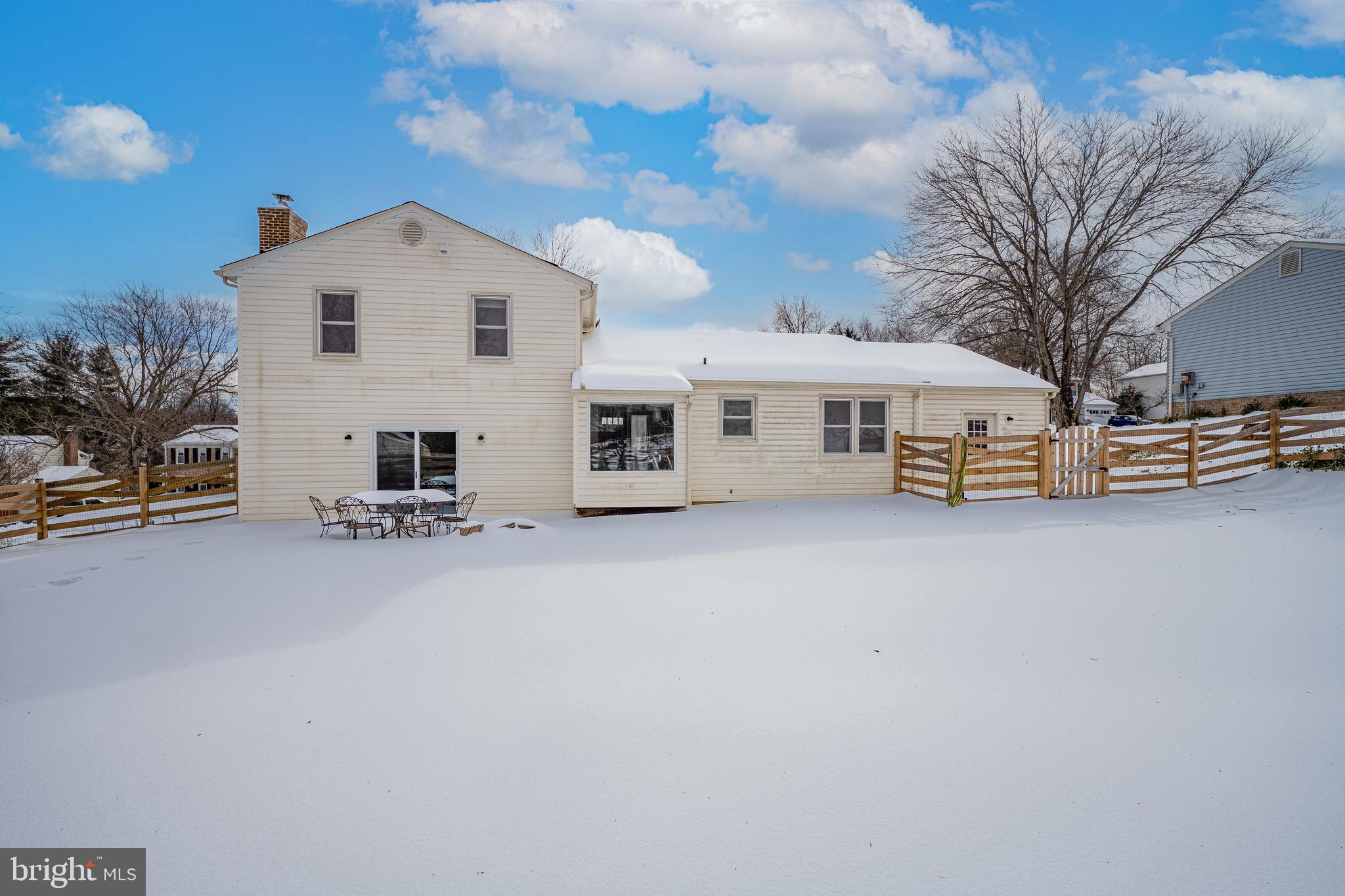 3205 Llewellyn Field Road Olney, MD 20832 - Photo 32 of 39 a view of a house with a snow in the background