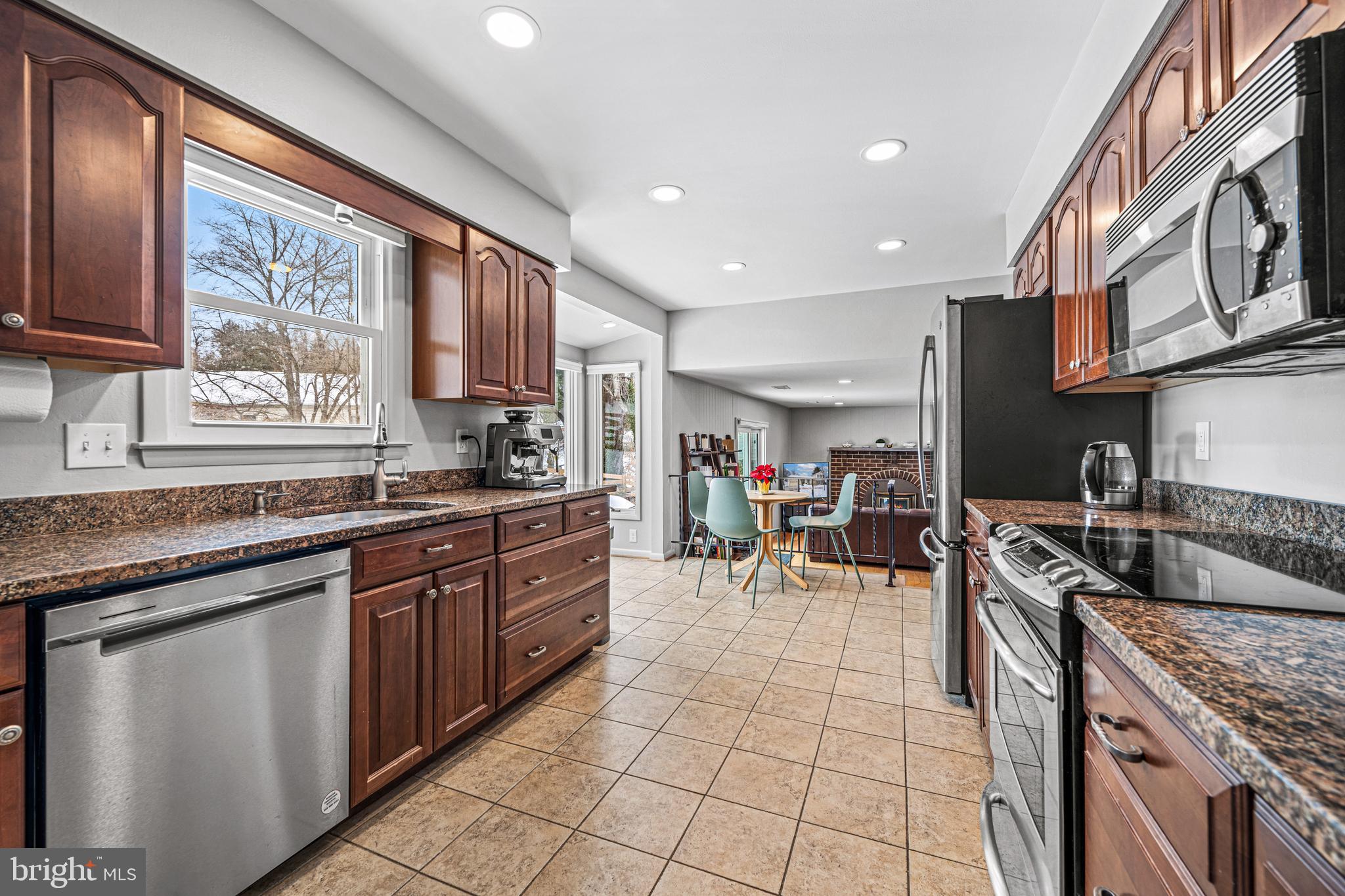 3205 Llewellyn Field Road Olney, MD 20832 - Photo 7 of 39 a kitchen with stainless steel appliances granite countertop a sink and cabinets