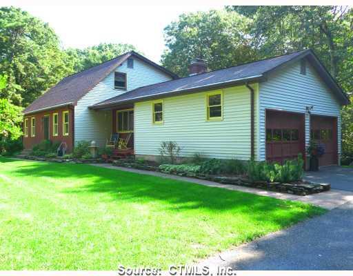 510 Carpenter Road Coventry, CT 06238 - Photo 1 of 1 a front view of a house with a garden