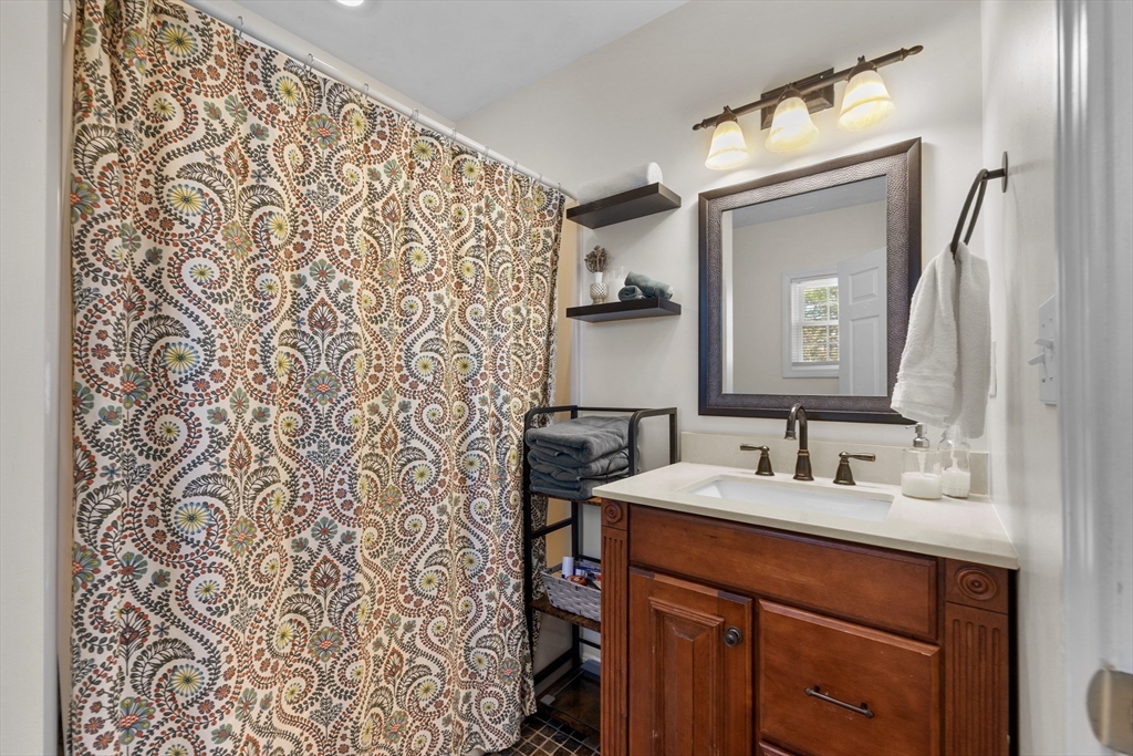 38 Brook Street Georgetown, MA 01833 - Photo 18 of 42 a bathroom with a sink and a mirror