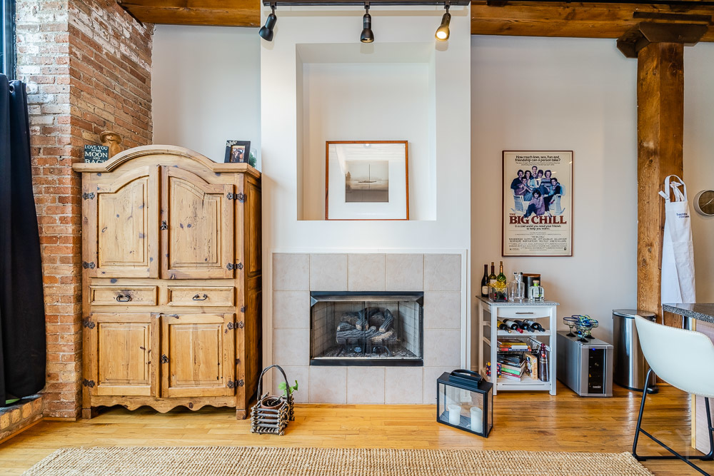 1250 West Van Buren Street, Unit 703 Chicago, IL 60607 - Photo 11 of 18 a living room with furniture and a fireplace