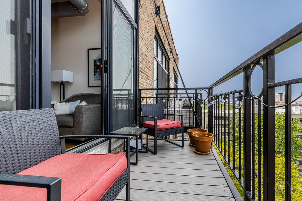 1250 West Van Buren Street, Unit 703 Chicago, IL 60607 - Photo 13 of 18 a view of a balcony with chairs