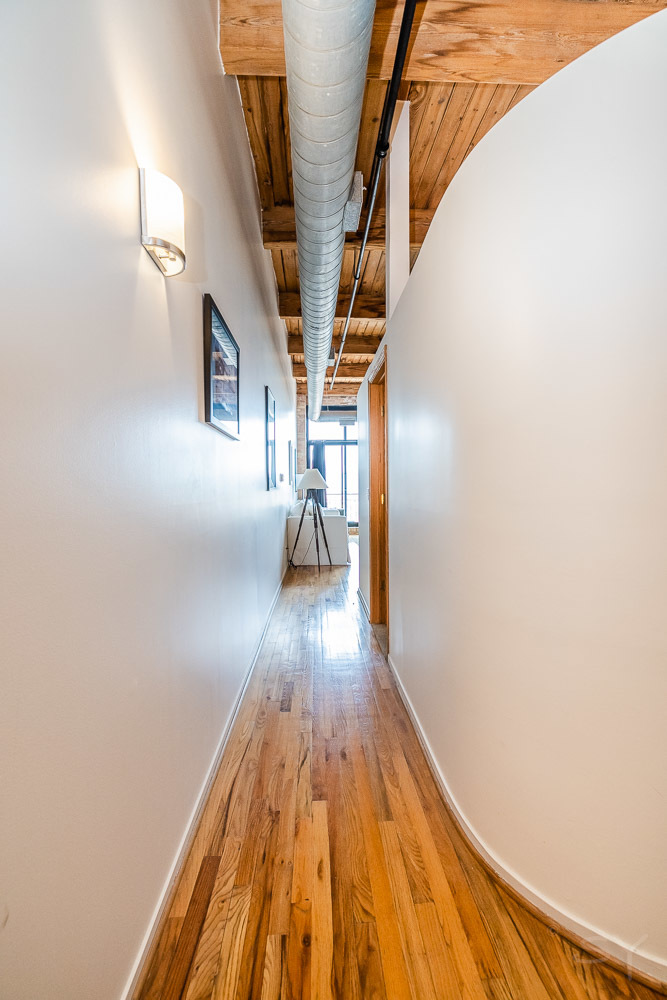 1250 West Van Buren Street, Unit 703 Chicago, IL 60607 - Photo 9 of 18 a view of entryway with wooden floor