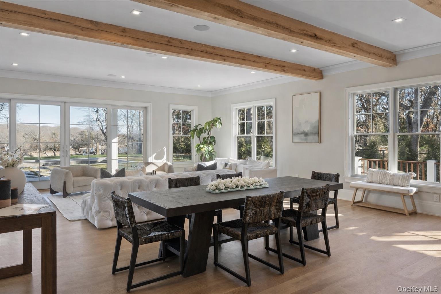 2590 Cox Neck Road Mattituck, NY 11952 - Photo 9 of 50 Expansive open-concept living with dramatic ceiling height, refined finishes and tranquil water vistas