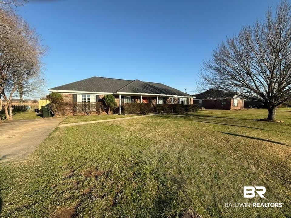 8912 Sherman Road Foley, AL 36535 - Photo 2 of 35 Ranch-style house featuring a front yard and driveway