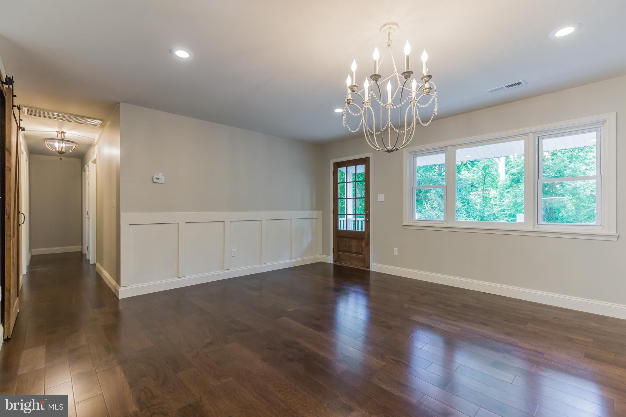 3725 Spruce Road Port Republic, MD 20676 - Photo 4 of 19 Entrance with Board and Batten and Wood Door