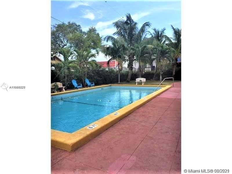 3640 Northwest 9th Street, Unit 105 Miami, FL 33125 - Photo 3 of 8 a view of swimming pool