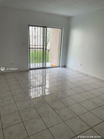 3640 Northwest 9th Street, Unit 105 Miami, FL 33125 - Photo 5 of 8 an empty room with windows