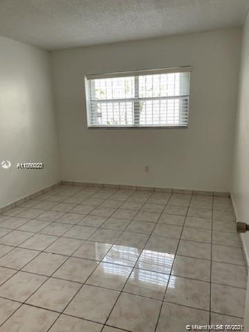 3640 Northwest 9th Street, Unit 105 Miami, FL 33125 - Photo 6 of 8 a view of room with window