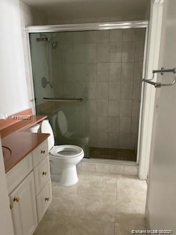3640 Northwest 9th Street, Unit 105 Miami, FL 33125 - Photo 7 of 8 a bathroom with a toilet and a shower
