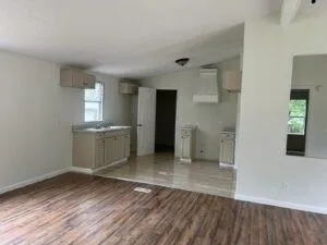 a view of a kitchen with a sink and a stove top oven