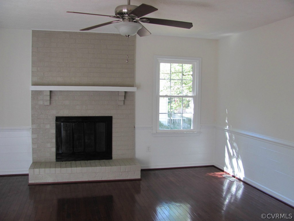7513 Barkbridge Road Chesterfield, VA 23832 - Photo 2 of 24 a living room with wooden floor and a fireplace